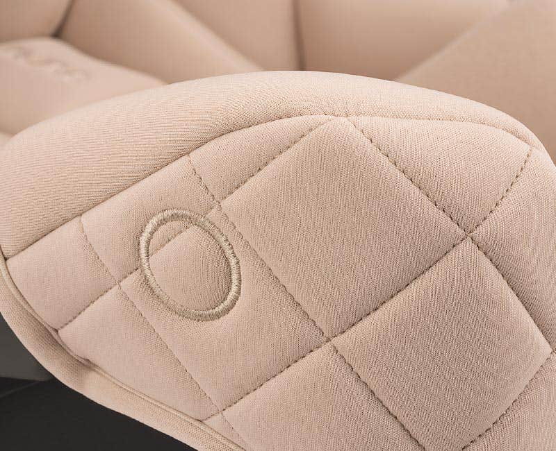 Close up of Nuna PIPA aire rx magnetic buckle holder and the mixed fabrics of the Monterey fashion