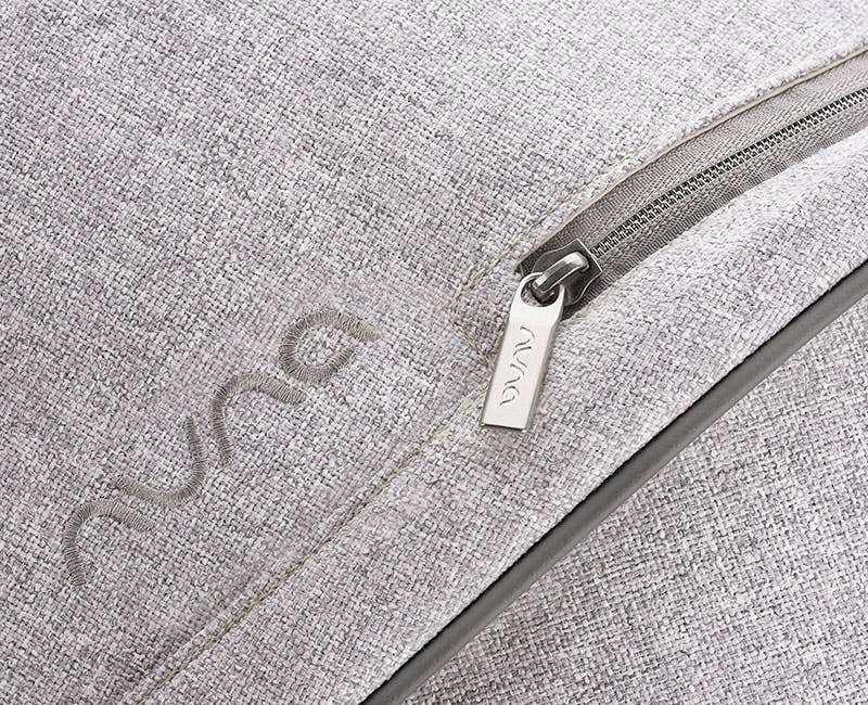 Close up of Nuna gray tweed stroller canopy with silver zipper from the Sterling Collection