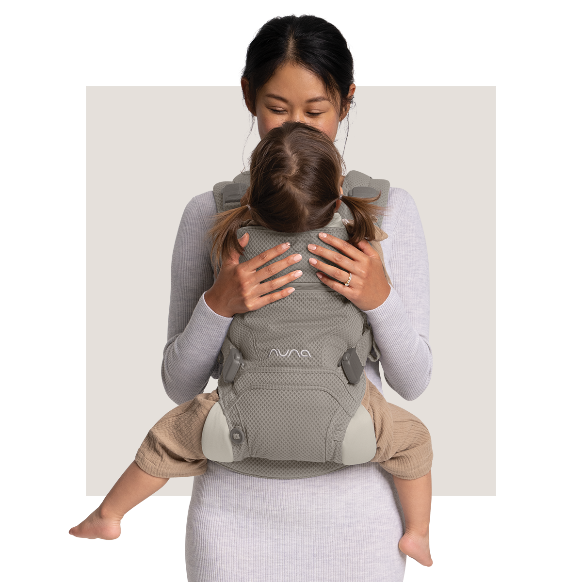 Mother smiles at toddler in CUDL clik baby carrier